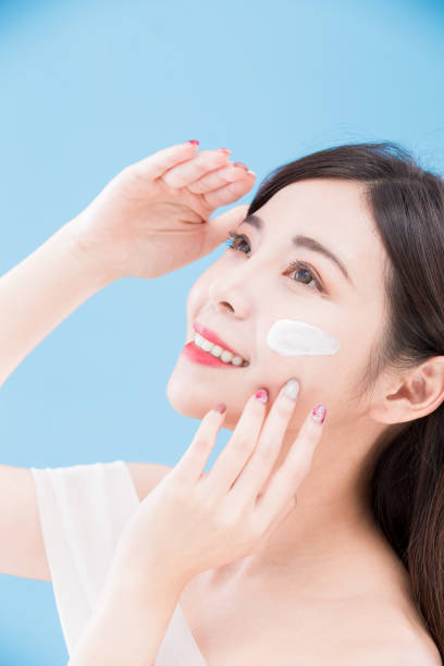 istock woman use sun cream 948392252