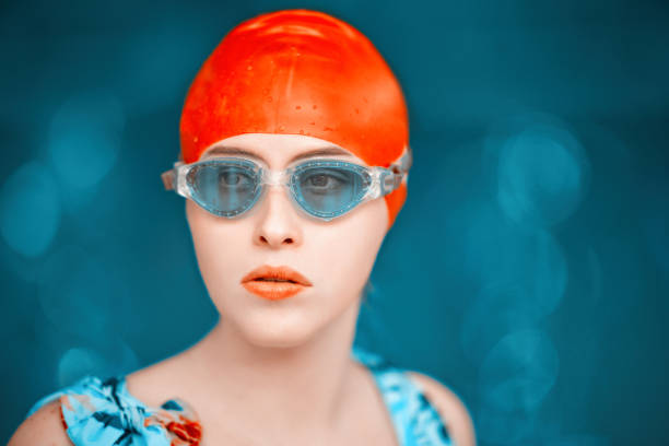 A young girl swims underwater wearing a mask.To see more underwater images click here: