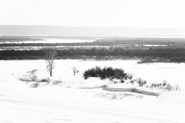 istock Winter Scene: Frosty Landscape with Frozen River and Trees 948403286