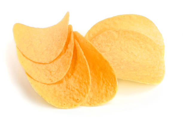 istock heap of potato chips on white background close-up 948408706