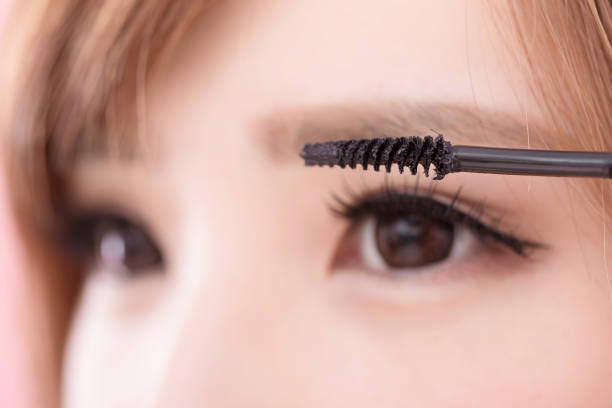 istock beauty woman take mascara 948411304