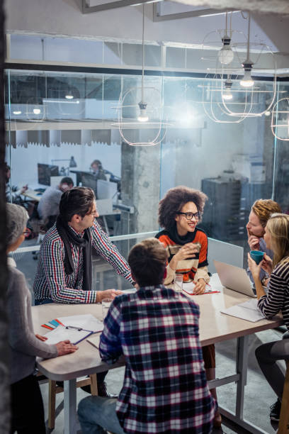 istock Happy colleagues talking about business strategy at corporate office. 948411502