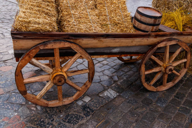Wooden cart with straw for decor during traditional fair