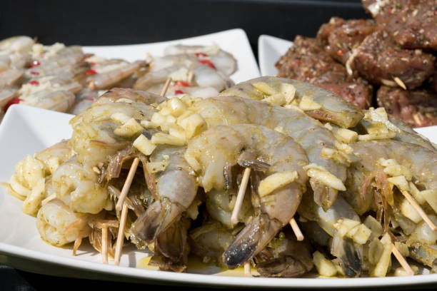 istock Prawns, meat and vegetables prepared for barbecue 948415298