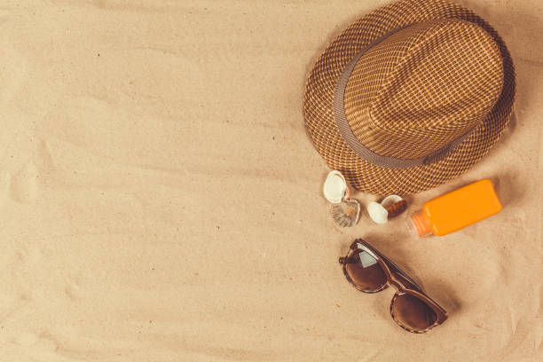 istock Summer hat put on the tropical sand beach 948415810