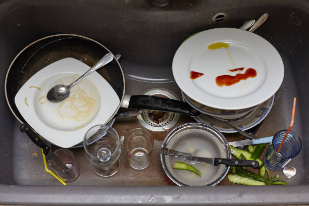 istock Dirty dishes and glasses in the sink. 948417414