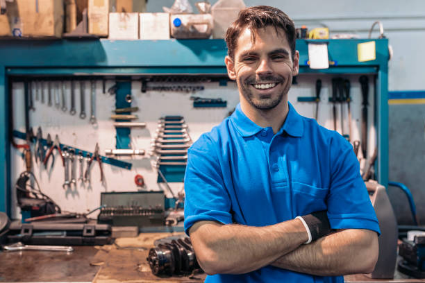 Portrait of Car Mechanic Man. Portrait of Car Mechanic Man in Garage. motor living stock pictures, royalty-free photos & images