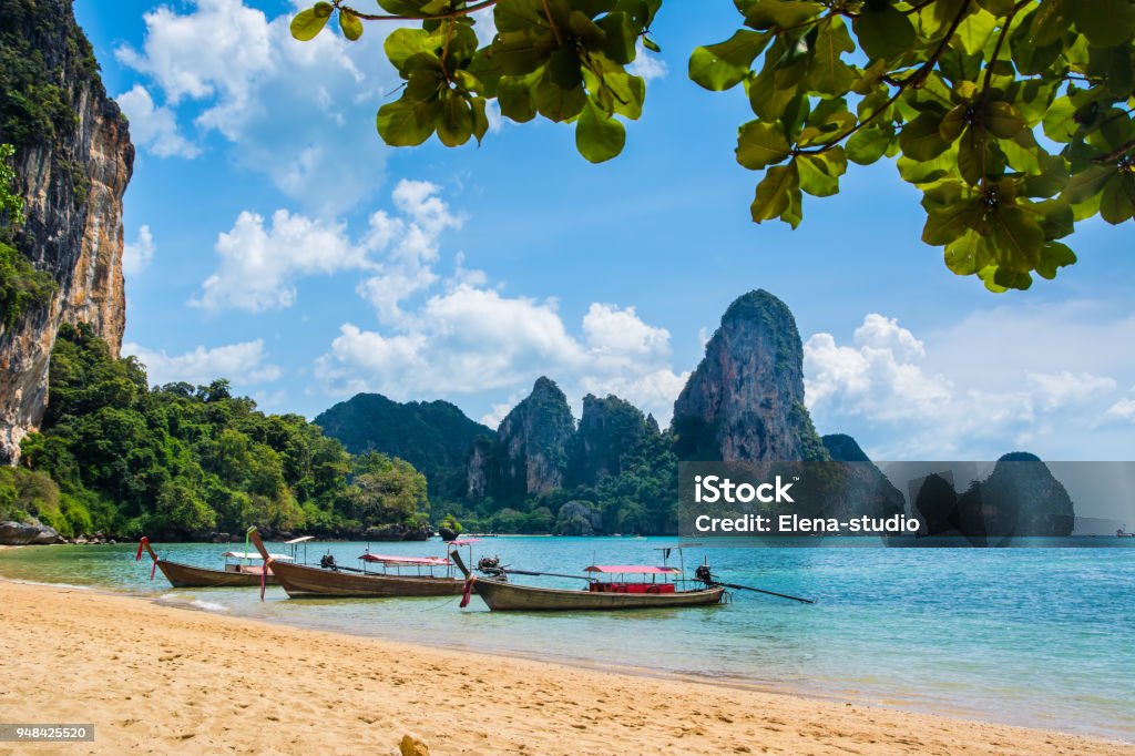 Amazing view of beautiful Ao Nang Beach with longtale boats. Location:  Krabi Province, Thailand, Andaman Sea. Artistic picture. Beauty world. Thailand Stock Photo