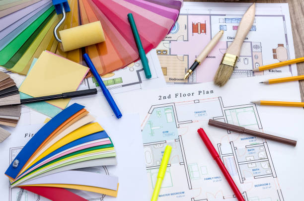 istock Architectural concept - home plan, color and wooden samples, brush and work tools 948425800