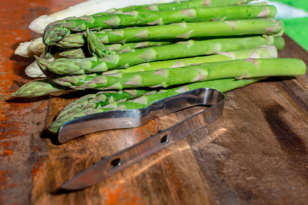 istock Raw uncooked fresh white and green asparagus high quality, ready to cook for dinner close up 948429242