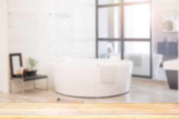 istock Empty wooden top table with blurred bathroom interior Background. for product display montage. 948429664