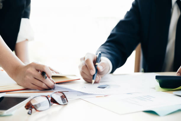 istock Business Team analyzing financial document and calculator on workplace - Corporate Organization Meeting Concept, Soft focus 948430280
