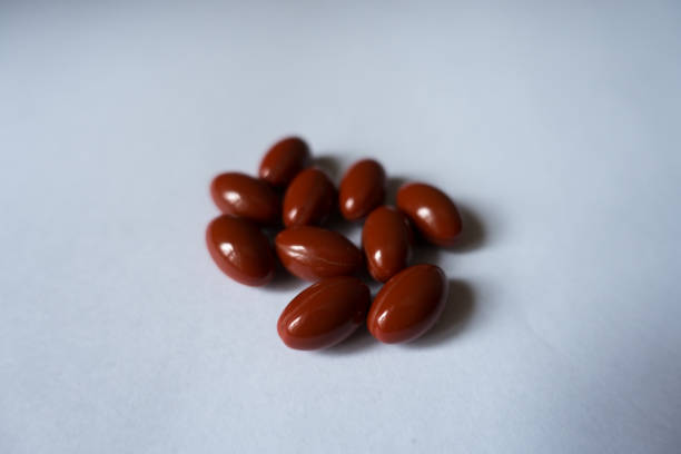 istock Several red capsules of lutein dietary supplement 948430996
