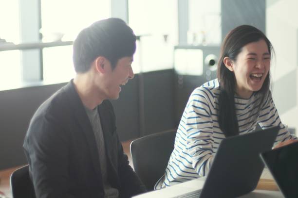 istock Young man and woman working in modern share offices 948431004