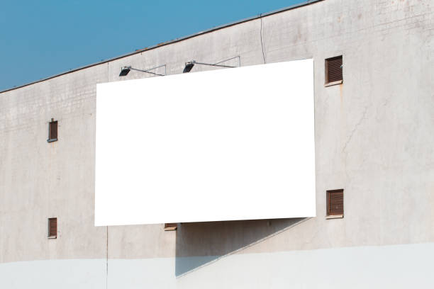 istock Mock up. Blank vertical billboard, poster frame, advertising on the the wall. 948433810