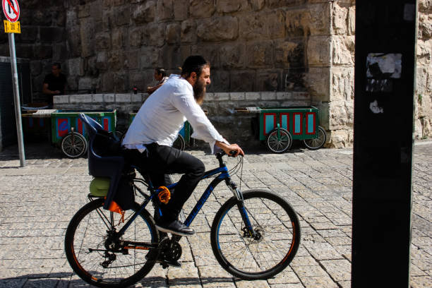 Jerusalem Israel April 16, 2018 Unknown man on bicycle in the street of the Old city of Jerusalem on afternoon