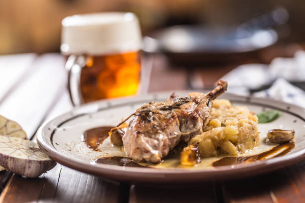 Iberian cutlet with mashes potatoes decoration and draft beere in pub or restaurant