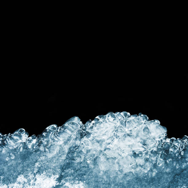 istock Natural ice texture isolated on a black background close-up. Freezing glacial, front view. Icy shape. Abstract background of ice structure. Place for text 948439260