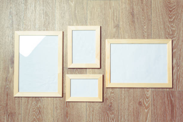 istock photo frames on the wooden wall 948442654