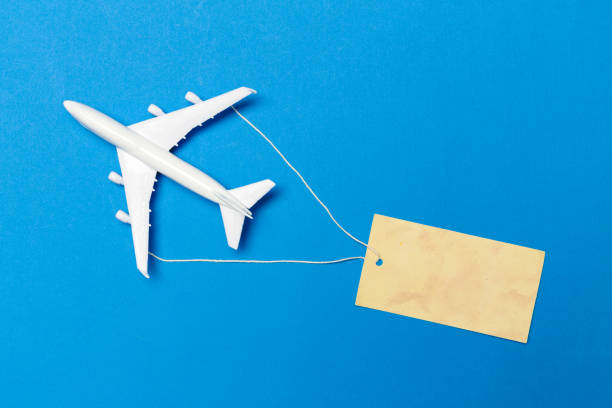 istock model of passenger plane on blue background 948444604