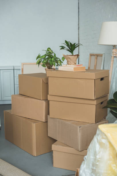 istock close up view of cardboard boxes in room 948444792