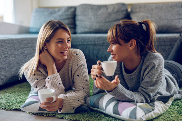 istock Cheerful lesbian couple enjoying spending time together 948444818