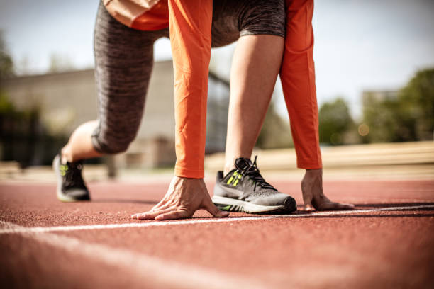 istock Close up image woman prepare for run. 948445092