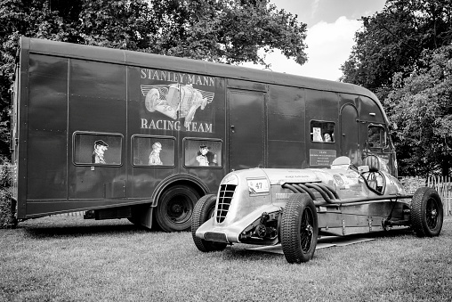 Vintage 1927 Bentley 6.5-Litre Old mother gun  Le Mans race car parked in front of a Bentley racing truck at the field during the 2014 Classic Days event at Schloss Dyck.
