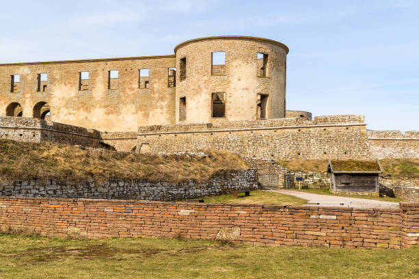 Historic castle ruin at Borgholm, Oland in Sweden. A popular travel destination with historic values. Main entrance for visitors that wants to see the inside of the ruin. Logo and text removed from sign.
