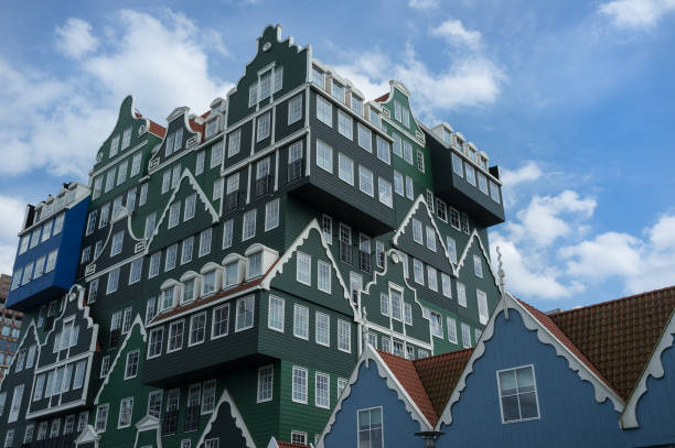 istock Beautiful building colored in green and blue with big white windows 948447664