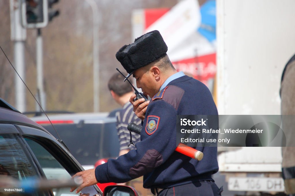 Kazakh Policeman A Kazakh Policeman making some traffic controls. The image was captured in Almaty city. Kazakhstan Stock Photo