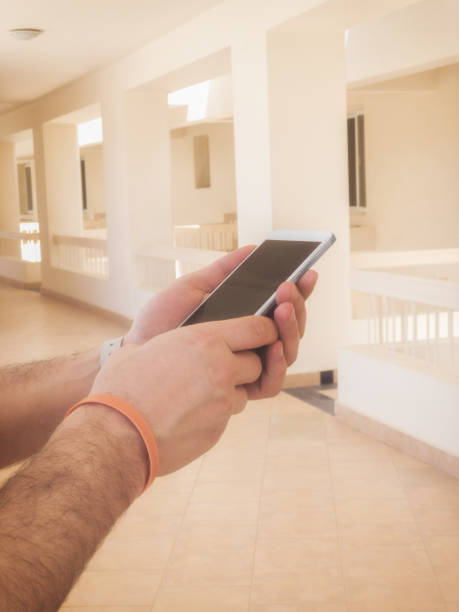 istock Man using cellphone / smartphone in urban surroundings. 948448440