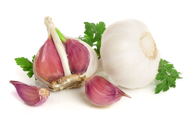 istock garlic with parsley leaf isolated on white background 948451276