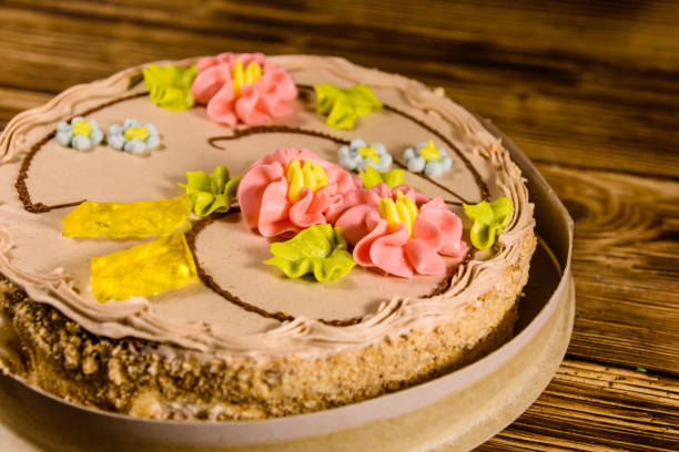 istock Kiev cake with cream on wooden table 948452342
