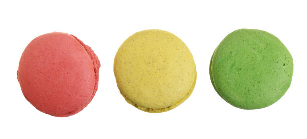 istock colored macarons isolated on white background without a shadow closeup. Top view. Flat lay 948455062