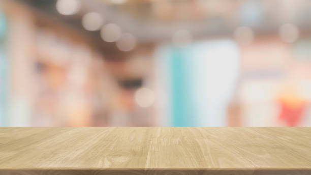 istock Empty wood table top and blurred restaurant interior background - can used for display or montage your products. 948456322