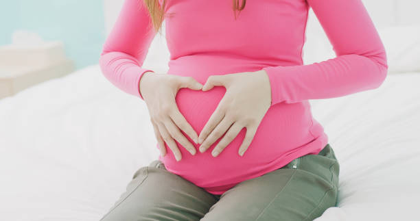istock close up pregnant women belly 948456690