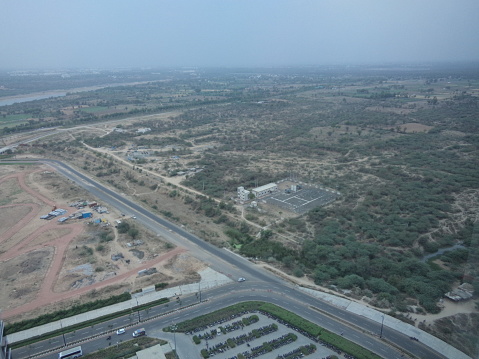 Aerial with of Kuwait City downtown with the Bader Al-Mailam Mosque and a large parking lot. Kuwait City. Kuwait.