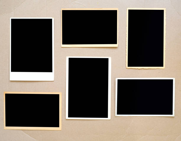 old empty photo frames, vintage photo prints on cardboard with free pics space
