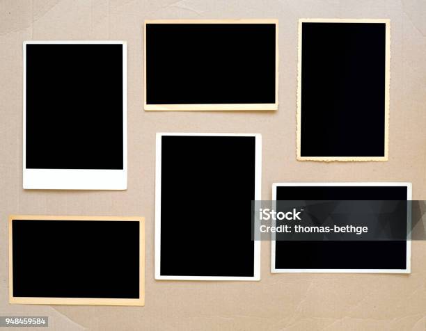 Old Empty Photo Frames Vintage Photo Prints On Cardboard With Free Pics Space Stock Photo - Download Image Now