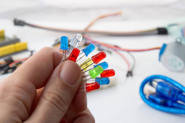 istock LED lamp for building simple automation systems and robots and microchips in the engineer's hand 948460178