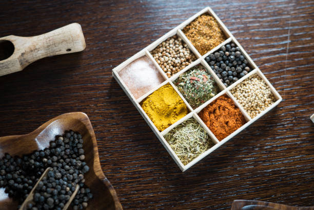 istock Wooden table of colorful spices 948463996