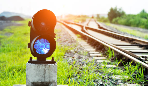 Blue light on railway track Blue light on railway track railway signal stock pictures, royalty-free photos & images