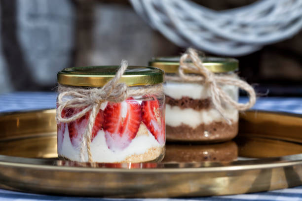 strawberry, biscuit dessert in jar strawberry, biscuit dessert in jar cake jar stock pictures, royalty-free photos & images