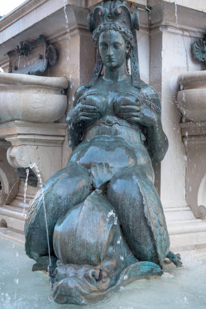 Kiev: Man with a sword holding the lady in her arms, a modern sculpture