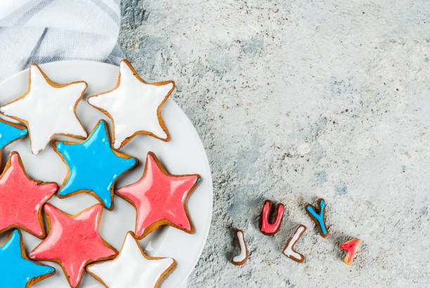 USA Independence Day background American USA Independence Day background concept, star cookies blue, red, white, July 4,light grey background copy space white sugar cookie stock pictures, royalty-free photos & images