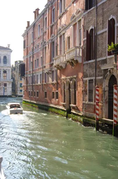 Photo of Speedboat going on a water channal of Venice