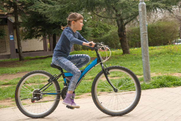 istock Girl rides a bike 948473204