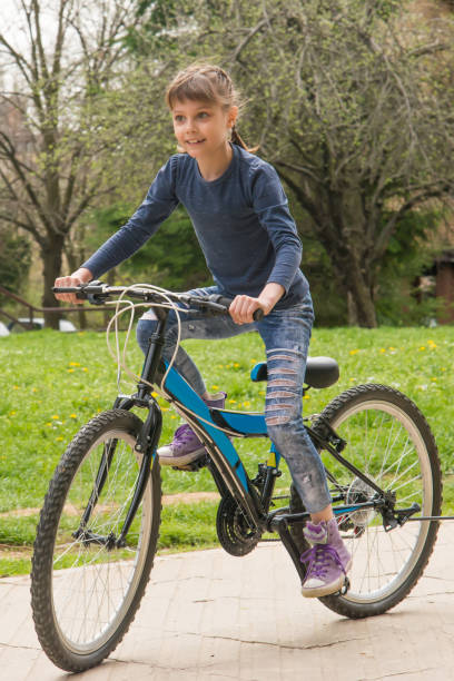 istock Girl rides a bike 948475326