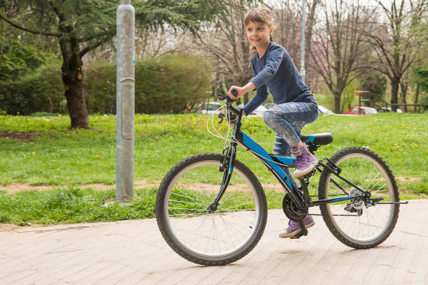 istock Girl rides a bike 948475330